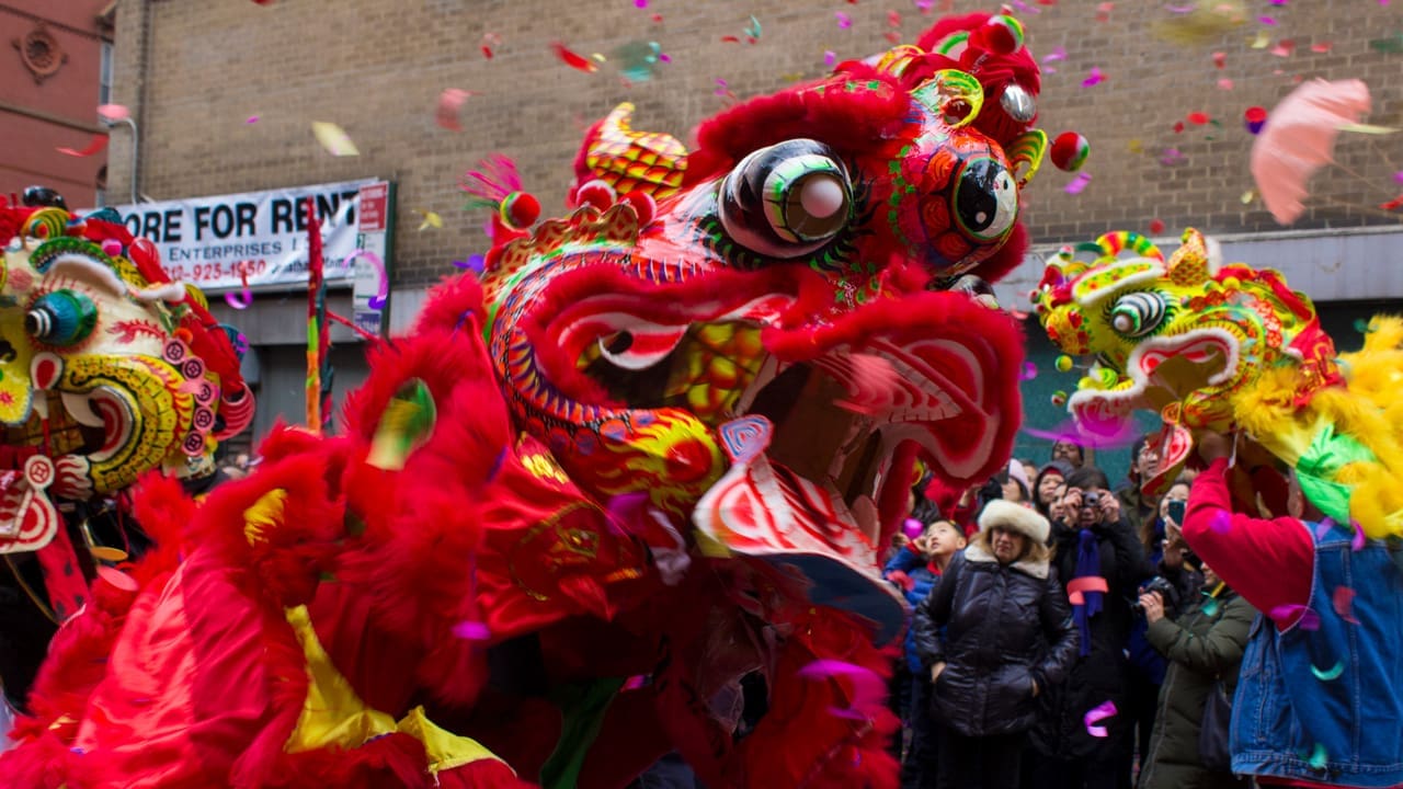 A dragon making its way across the streets of New York City.
