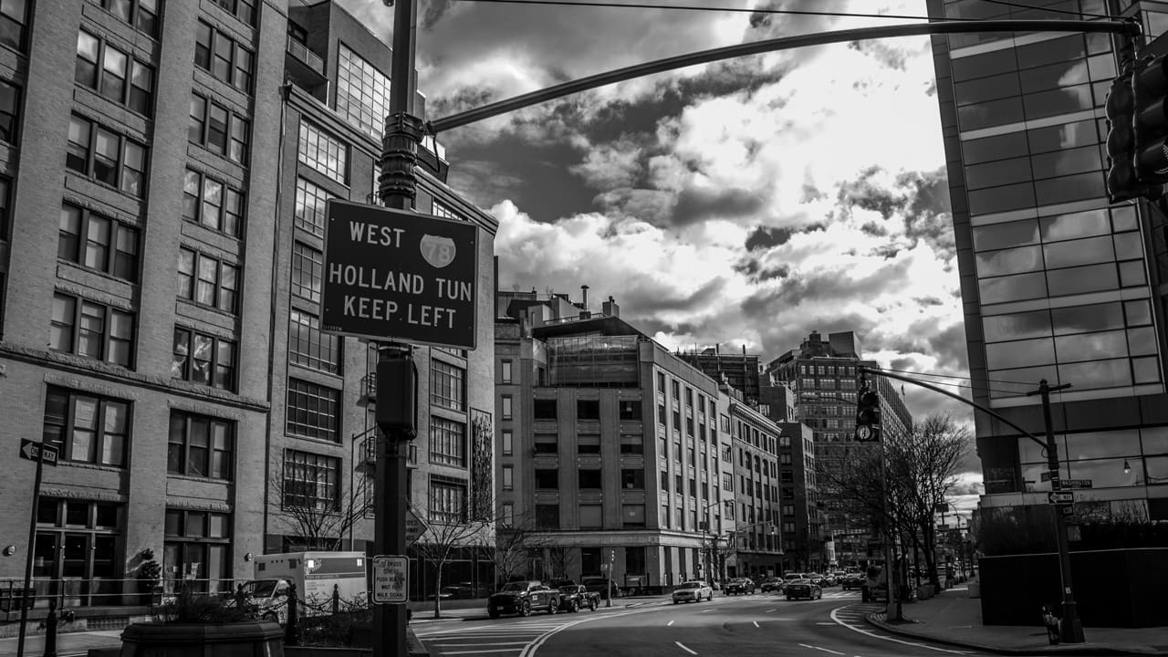 A sign telling people to keep left for the Holland Tunnel and Interstate 78 West.